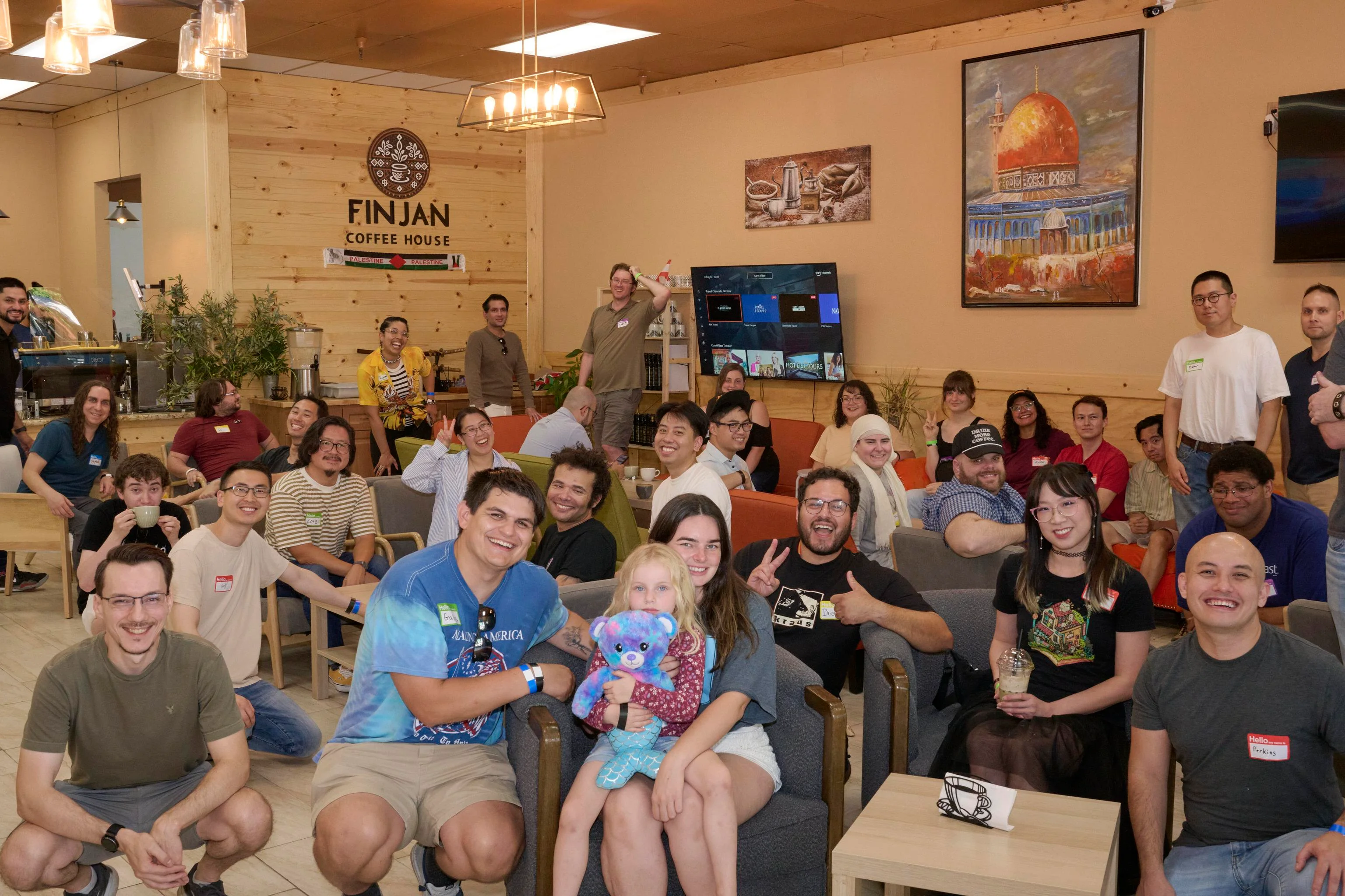 A community meetup gathered inside Finjan Coffee House
